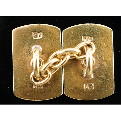 902 - A pair of mid 20th century two colour 18ct gold and single stone diamond set cufflinks, of shaped re... 