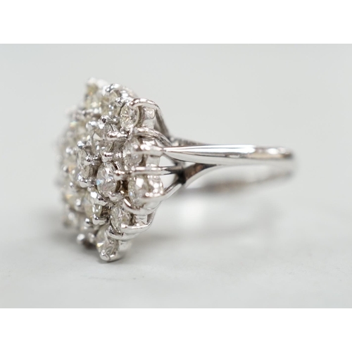 910 - An 18ct white metal and diamond set hexagonal cluster ring, size L, gross weight 6.3 grams.