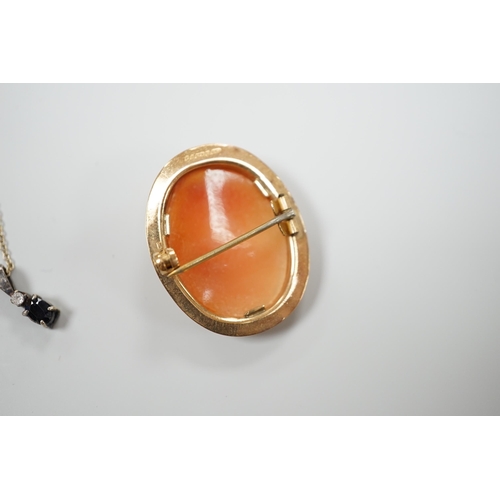 918 - A modern 9ct gold mounted oval cameo shell brooch and two pendant necklaces including one 9ct.... 