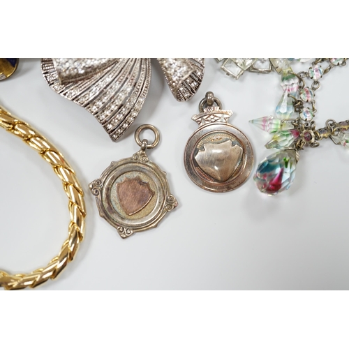 919 - A small collection of assorted costume jewellery including a marcasite set pendant necklace.