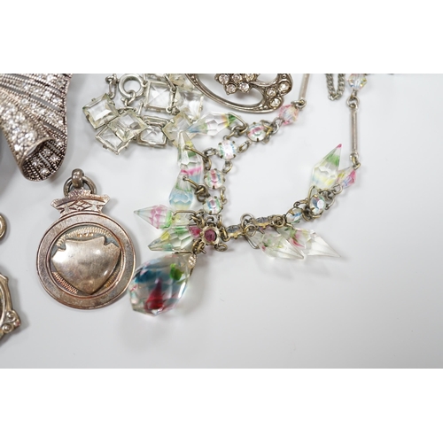 919 - A small collection of assorted costume jewellery including a marcasite set pendant necklace.