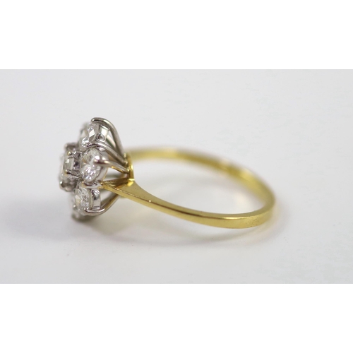 942 - A modern 18ct gold and seven stone diamond set flower head cluster ring, size M/N, gross weight 3.8 ... 