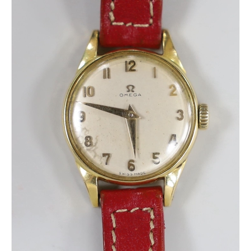 947 - A lady's 18k Omega manual wind wrist watch, on a leather strap with 9ct gold buckle with Omega insig... 