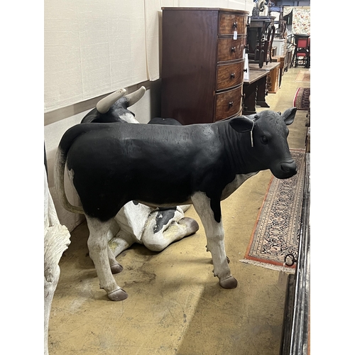 3 - A life size composition Friesian calf garden ornament, length 118cm, height 96cm