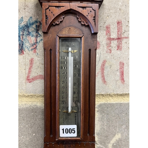 1005 - A Victorian walnut cased aesthetic movement style aneroid barometer and thermometer, Negretti & Zamb... 