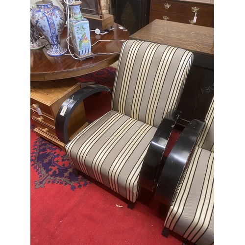 1018 - A pair of Deco style ebonised upholstered armchairs, width 78cm, depth 92cm, height 87cm