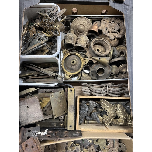 1026 - A quantity of assorted brass furniture mounts, escutcheons, locks, hinges, etc.