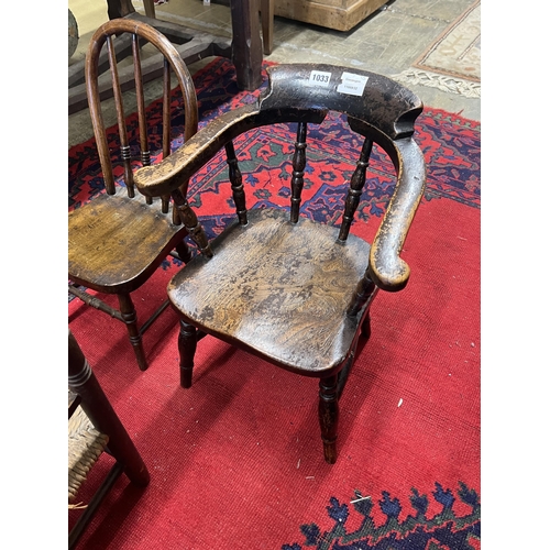 1033 - A child's Victorian elm and beech bow chair, a single chair and a rush seat chair