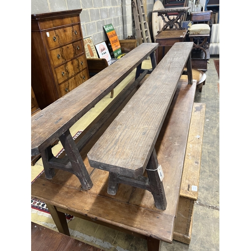 1036 - A pair of late 19th century French oak benches, length 210cm, depth 20cm, height 42cm