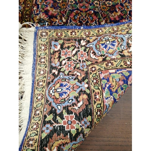 1038 - A North West Persian part silk blue ground rug, 89cm x 58cm