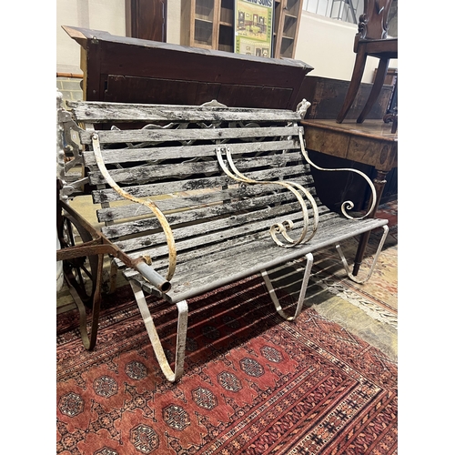 1047 - A vintage wrought iron and weathered teak two-seater garden bench, length 121cm, height 82cm