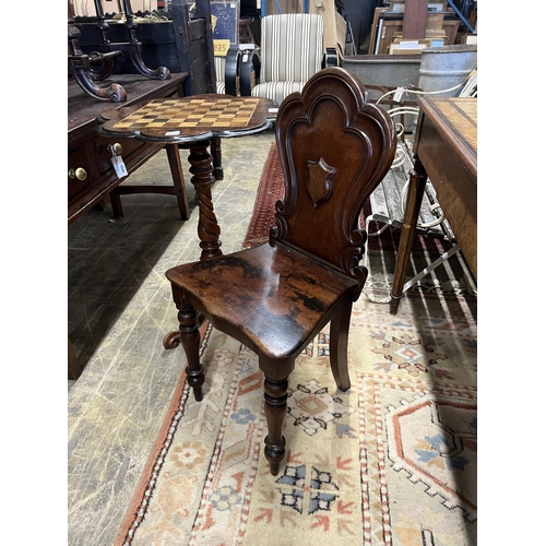 1048 - A Victorian mahogany hall chair and a Victorian walnut tripod games table, width 56cm, height 73cm... 