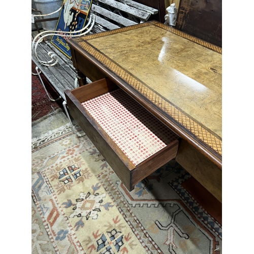 1049 - A good quality French Empire style writing table, width 121cm, depth 62cm, height 75cm