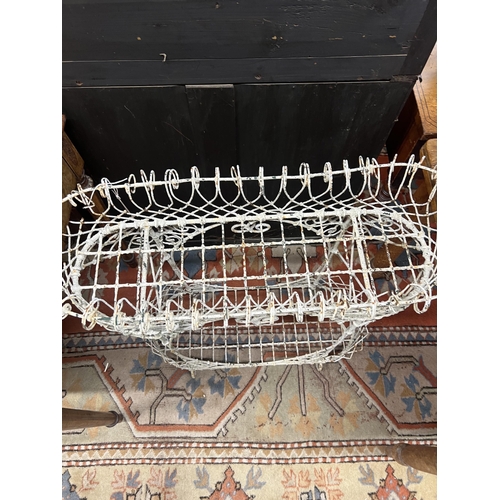 1050 - A Victorian painted wirework two tier pot stand, width 79cm, height 82cm