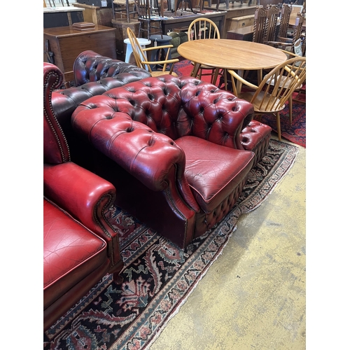 1056 - A Thomas Lloyd buttoned burgundy leather Chesterfield sofa, length 200cm, depth 85cm, height 72cm, t... 