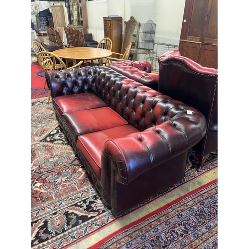 1056 - A Thomas Lloyd buttoned burgundy leather Chesterfield sofa, length 200cm, depth 85cm, height 72cm, t... 