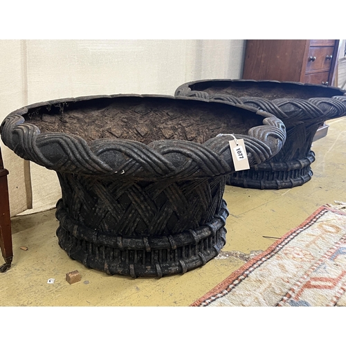 1077 - A large pair of circular weathered cast iron planters, diameter 82cm, height 43cm