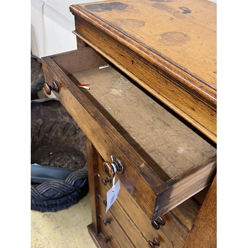 1078 - A Victorian oak eight drawer Wellington chest, width 60cm, depth 38cm, height 127cm