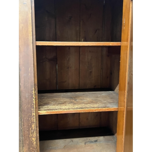 1081 - A Victorian pine four door household cupboard, width 109cm, depth 48cm, height 194cm