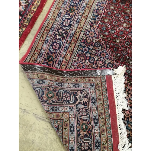 1090 - A Bidjar red ground carpet, 330cm x 223 cm