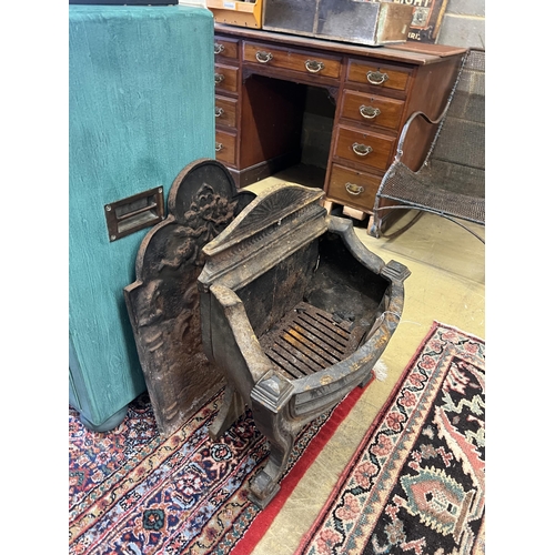 1113 - A 19th century cast iron bow front fire grate, width 56cm, depth 28cm, height 61cm together with a c... 