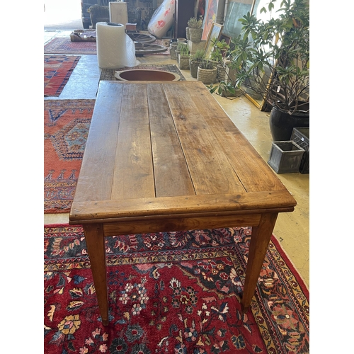 1118 - A 19th century French cherry farmhouse table with single extension on square tapered legs, width 166... 