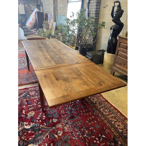 1118 - A 19th century French cherry farmhouse table with single extension on square tapered legs, width 166... 