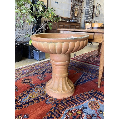 1123 - A circular terracotta garden planter, diameter 60cm, height 67cm