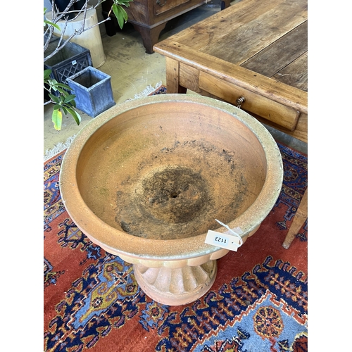 1123 - A circular terracotta garden planter, diameter 60cm, height 67cm