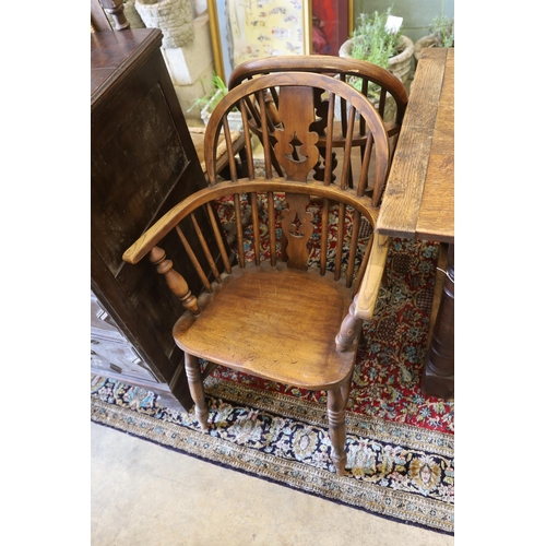 1130 - A near set of four 19th century Nottingham area elm, ash and beech Windsor elbow chairs, possibly by... 