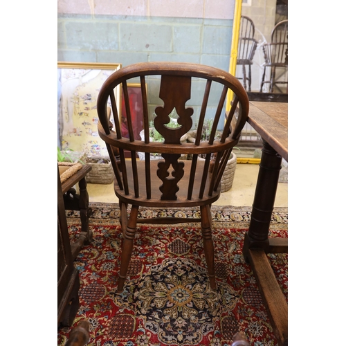 1130 - A near set of four 19th century Nottingham area elm, ash and beech Windsor elbow chairs, possibly by... 