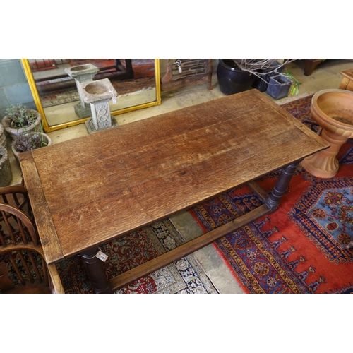 1135 - An 18th century and later rectangular oak refectory dining table, width 183cm, depth 79cm, height 77... 