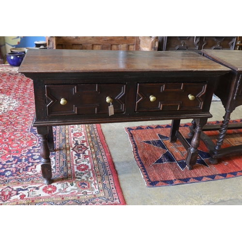 1136 - A small 18th century and later oak two drawer low dresser, width 133cm, depth 55cm, height 85cm... 