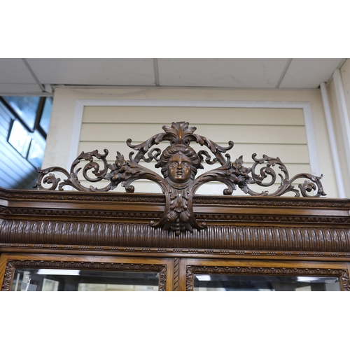 1140 - An early 20th century George I style carved walnut vitrine, width 138cm, depth 50cm, height 218cm... 