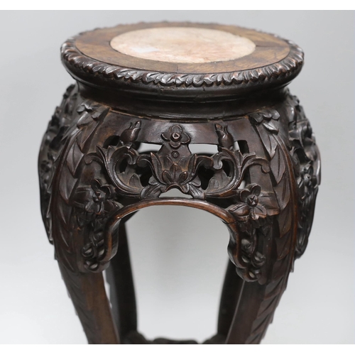 1157 - A Chinese carved hardwood marble topped vase stand, height 46cm