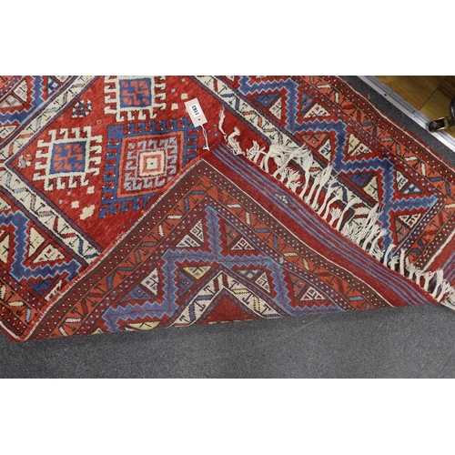 1163 - A Turkish red ground rug, 134 x 99cm