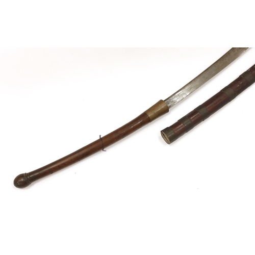 1252 - A large 19th century Burmese dha, in a wooden scabbard with metal bands, long wooden grip, blade 67.... 