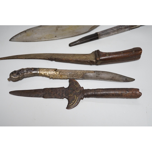 1253 - Two Sinhalese daggers and a kukri, a silver inlaid Kirichchiya dagger, together with another in a sc... 