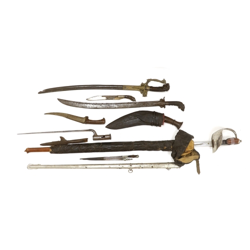 1253 - Two Sinhalese daggers and a kukri, a silver inlaid Kirichchiya dagger, together with another in a sc... 