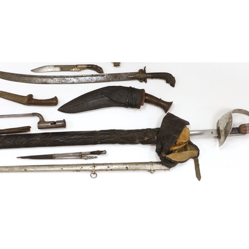 1253 - Two Sinhalese daggers and a kukri, a silver inlaid Kirichchiya dagger, together with another in a sc... 