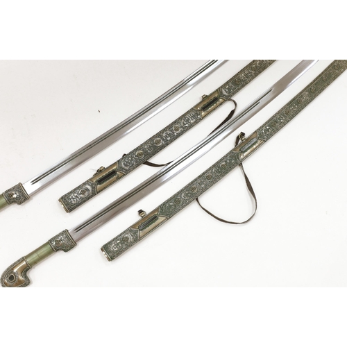 1258 - A pair of reproduction Turkish swords with white metal filigree scabbards, blades 80cm