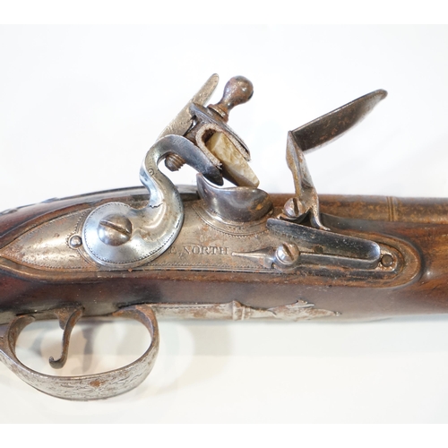 1267 - A partly silver mounted flintlock holster pistol by E. North of London, c.1760, engraved iron trigge... 