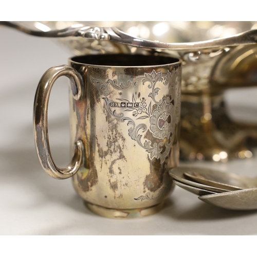 1850 - A George V silver christening mug, two silver spoons, four white metal spoons, a pierced white metal... 