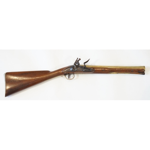 An English brass barrel flintlock blunderbuss by H W Mortimer, late 18th  century, flared brass barre