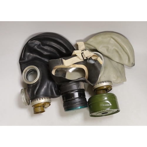 1281 - Three gas masks, including a boxed childs mask with instructions on inside of the lid