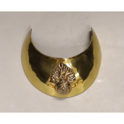 1282 - A Royal Fusilliers brass gorget, diameter 12.5cm