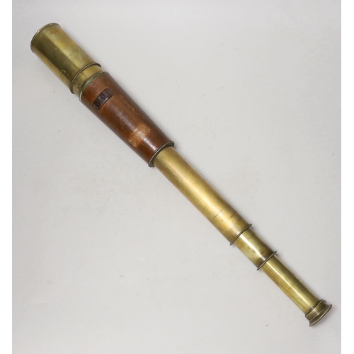 1284 - A WWI three draw brass telescope with sun shade and leather outer cover by Taylor Taylor Hobson Ltd.... 