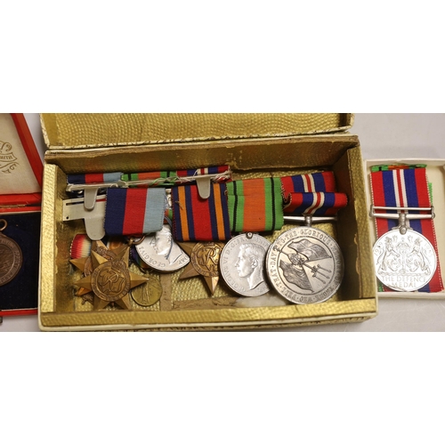 1287 - Three WWII medal groups and a German medal etc., a boxed WWII pair (addressed to Mrs Howard-White); ... 