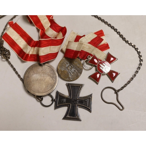 1288 - Four German medals including an iron cross, a Hamburg Kreuz 1914 with Fur Verdienft im Kriege 1914... 