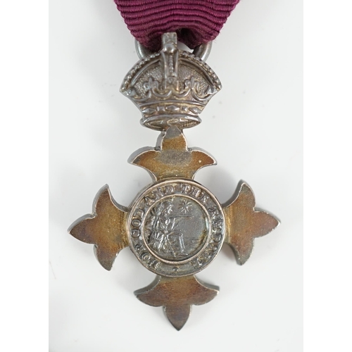 1295 - A cased George V military MBE containing leaflet with instructions as to wearing Insignia, together ... 